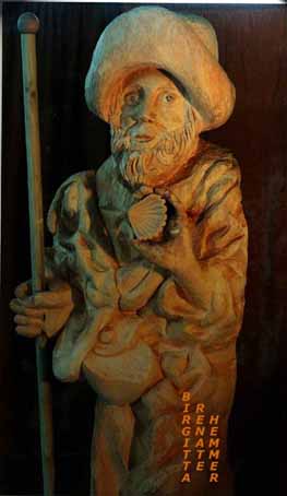 Wood sculpture of James, with an expressive head